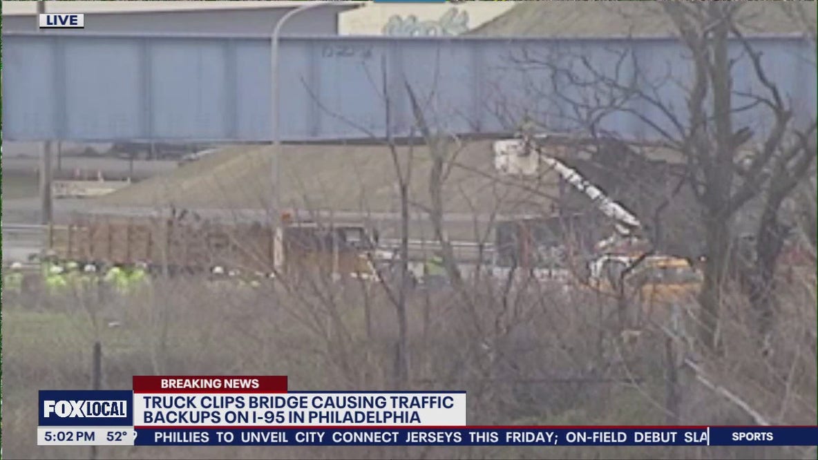 Truck clips bridge causing traffic backups on I-95 in Philadelphia